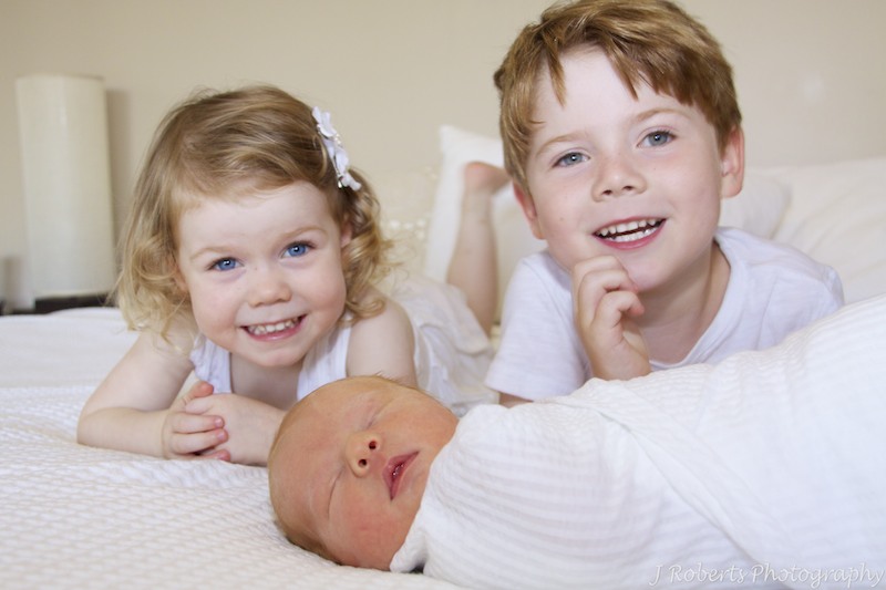 Siblings with newborn baby - newborn portrait photography